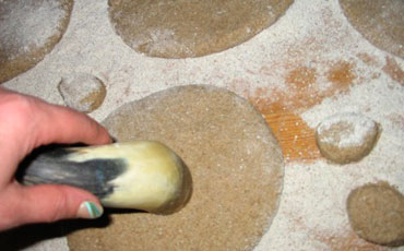 Making a hole in a bread with hole maker.