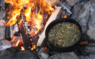 Pan over the fire shows how Pan bread was baked.